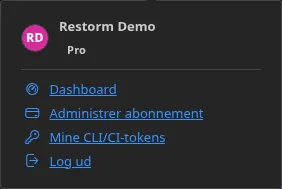 Menuen fra Konto-knappen i logget ind-tilstand: indehaverens navn og udgave og derefter punkterne »Dashboard«, »Administrer abonnement« og »Log ud«